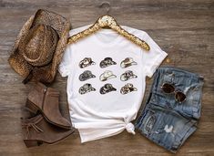 Cowboy hat graphic tee, Cowboy Hat Shirt, Cowgirl shirt, Cowboy Shirt Women, Western Shirt, Faux Cowhide Tee, Country Western T- Shirts ♥ HOW TO ORDER T-SHIRT ♥ 1- Please, Check and Review all Photos. 2- Choose your size from the drop-down menu and add each shirt to your cart one at a time. 3- Select Your Shirt Color from Drop-down 2 which is Shirt Color. 4- Choose Your TEXT Color. Please add your text color on to the personalization box. 5- Your shipping will automatically combine when ordering multiples. 6- Checkout out all at once when the correct color and qty has been added. 7- Finally, Your Custom Shirt will be ready to ship 1-3 Business Day. Holiday times may affect the handling times. -Our shirts are made to order specially for you. Because of this reason we don't accept returns or Summer Cotton Hats With Graphic Print, Cotton Hats With Graphic Print For Summer, Cotton Summer Hat With Graphic Print, Cowboy Hat Graphic, 25th Bday, Baby Clothes Country, Faux Cowhide, Cute Country Outfits, Chapeau Cowboy