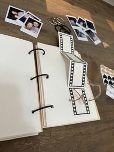 an open book on a table with pictures and scissors