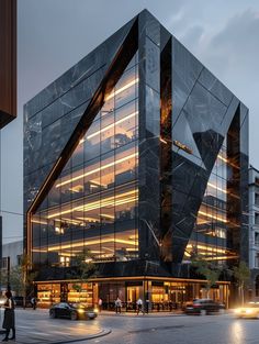 a large building with many windows on the side of it's face at night