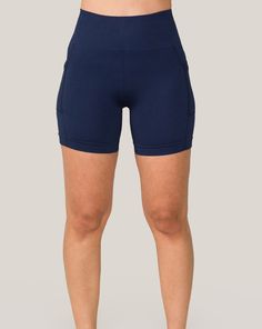 Offering a complete range of motion and reliable seamless support, these flattering navy seamless pocket shorts for women will inspire you to go far. This style of navy seamless pocket shorts runs small. Please consider sizing up. Seamless 4-way Stretch Shorts, Functional Solid Color Seamless Shorts, Navy Athleisure Activewear With Built-in Shorts, Navy Activewear With Built-in Stretch Shorts, Navy Activewear With Built-in Shorts For Training, Navy Stretchable Training Shorts, Navy Stretch Training Shorts, Navy Activewear With Built-in Shorts For Gym, Navy Stretch Activewear Shorts