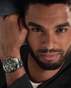 a close up of a person wearing a watch