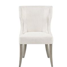 a white upholstered chair on a white background