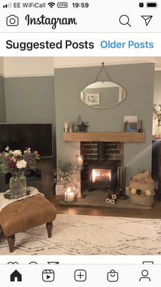 a living room filled with furniture and a fire place next to a tv mounted on a wall