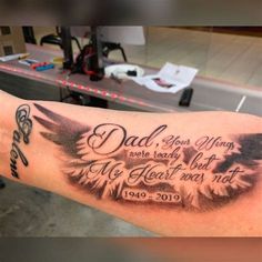 a man with a tattoo on his arm that says dad is the best wing ever