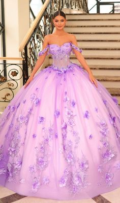 Long off the shoulder tulle a-line quinceanera ball gown with sweetheart neckline, sheer corset bodice and floral applique. Dramatic Prom Dresses, Ballroom Extravaganza, Floral Ball Gown, Purple Wedding Dress, Voluminous Skirt, Lavender Dress, Pretty Quinceanera Dresses, Quince Dress, Lilac Pink