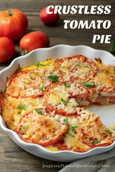 a pizza pie with tomatoes and cheese in the middle on a plate next to some cherry tomatoes