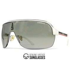 Details: -Color: White frame / Grey shield lens by Carrera -Size: Large / Frame width 141 mm / Frame height 53 mm / Temple length 115 mm -Made in Italy -Item-No. Carrera Topcar I Info/description: -Carrera's love for design and detail is evident from the spectacular collection of Carrera sunglasses that the brand has created for its fashion lovers worldwide. -The brand brings forth an opportunity to select from the most exceptional range of materials that range from aluminum to metal to plastic. Vintage Aviator Sunglasses With Uv Protection For Outdoor, Vintage Aviator Sunglasses With Tinted Lenses For Outdoor, Retro Sunglasses With Gradient Lenses For Outdoor, Retro Polarized Sunglasses For Streetwear, Vintage Aviator Sunglasses For Summer Outdoor, Vintage Polarized Sunglasses For Streetwear, Vintage Mirrored Sunglasses For Streetwear, Vintage Aviator Sunglasses With Anti-reflective Coating For Outdoor, Vintage Aviator Sunglasses For Outdoor With Anti-reflective Coating