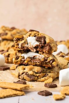 chocolate chip cookies with marshmallows are stacked on top of each other