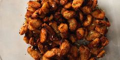 fried food sitting on top of a white plate