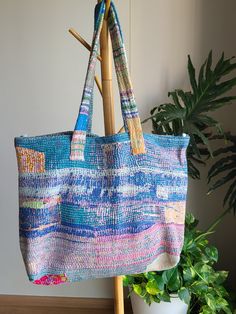 Indulge in the timeless beauty of our kantha tote bag, meticulously handcrafted by skilled indian artisans. each bag showcases the rich heritage of kantha embroidery, boasting vibrant colors and intricate patterns. with its spacious design and durable construction, this tote bag effortlessly combines style and functionality. experience the allure of artisanal craftsmanship and make a statement with this unique accessory. shop now and embrace the artistry of india's finest artisans. by opting for Multicolor Weaving Work Bag For Everyday, Daily Use Tote Bag With Weaving Work, Ethically Sourced Rectangular Travel Bag, Fair Trade Multicolor Tote Shoulder Bag, Multicolor Fair Trade Tote Shoulder Bag, Multicolor Travel Bags With Weaving Work, Multicolor Fair Trade Bags For Daily Use, Multicolor Fair Trade Shopping Bags, Fair Trade Multicolor Beach Bag For Travel