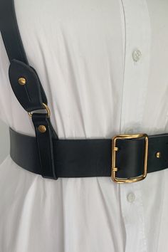 Made of genuine full grain leather, with beautiful black edges and black back.  Gold-colored hardware with a double prong bucket and collar pin. This beautifully made harness allowed for the easiest wardrobe update. 
Wear this classic black belt with or without the harness to define your look. Layer with the harness over dresses, tops, sweaters and suits for an edgy and modern look. Made for "The True Size Majority" sizes 10-22 by BAACAL Cynthia Vincent. Collar Pin, Suspenders For Women, Leather Halter, Collar Pins, Corset Belt, Wardrobe Update, Leather Harness, Black Back, 10 22