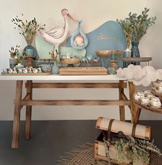 a table topped with lots of different types of food next to a vase filled with flowers