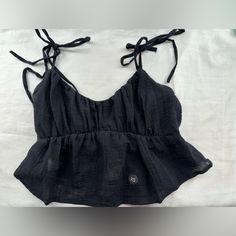 Black Cropped Tank Top From The Pacsun La Hearts Collection In Size Xs / Never Worn (The Straps Are Fraying Slightly) Beach Cami Top With Tie Back, Summer Cropped Tops With Adjustable Straps, Black Tank Top With Adjustable Straps For The Beach, Casual Cami Crop Top With Tie Back, Beach Crop Top With Tie Straps, Cropped Tops With Tie Straps For Vacation, Casual Vacation Tops With Adjustable Straps, Summer Tie Back Tops For Beach Season, Casual Cami Top With Tie Back