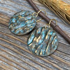 Unique Boho Inspired Vintage Patina dangle earrings-made with Natural Brass. Includes 10K Gold Plated Ear Wire and Silicone Earring Backs: These earrings are perfect if you are looking for that southwestern boho look. Throw them on with any outfit and they will definitely add some character. Perfect with a white T and a pair of jeans! These earrings are medium size, but very light weight and a perfect everyday wear. They are approximately 1.5 inches in length and 1 inch at the widest portion. To Handmade Rustic Bronze Earrings, Bohemian Gold Earrings With Patina, Rustic Handmade Earrings For Jewelry Making, Gold Bohemian Earrings With Patina, Rustic Drop Earrings With Ear Wire, Handmade Rustic Earrings For Jewelry Making, Rustic Dangle Earrings For Festivals, Rustic Brass Dangle Earrings, Rustic Copper Drop Earrings