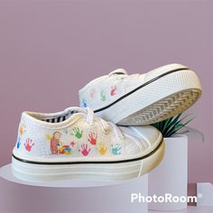 Custom Canvas Sneaker. Curious George With Pint Bucket Making A Mess As Usual!! And Multi Color Handprints All The Way Around The Shoe. White Non-slip Canvas Shoes For School, White Non-slip Canvas Shoes With Round Toe, White Canvas Shoes With Round Toe For School, Fun White Sneakers For Playtime, White Canvas Shoes With Rubber Sole, White Non-slip Fun Sneakers, Non-slip White Sneakers, Fun White Non-slip Sneakers, Fun Non-slip White Sneakers