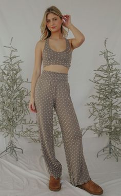 Make the Dawn Dot Pant a permanent part of your lounge wardrobe that you can wear all season, even all year. These pants are made of a soft brushed knit in a flocked dot print with smocked high waist and relaxed fit. Lili is 5'7" and is wearing size extra small extra small measurements: 24" waist | 14" length 95% polyester | 5% spandex PRODUCTS ON SALE ARE FINAL SALE! Feel free to email us at orders@shopriffraff.com or DM us with any questions regarding fit, styling, or our return policy in gene Dot Print, Cocoa, Dots, High Waisted, Relaxed Fit, Wardrobe, Knitting, Pants, How To Wear