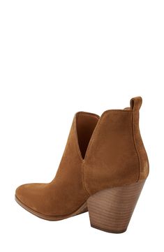 Subtle cutouts charm the timeless silhouette of a bootie lofted by a stacked setback heel for extra style points. 2 1/2" heel Leather upper/synthetic lining and sole Imported Chic Booties With Stacked Low Heel, Suede Booties With Stacked Low Heel, Marc Fisher, Medium Brown, Bootie, Nordstrom Rack, Leather Upper, Nordstrom, Heels