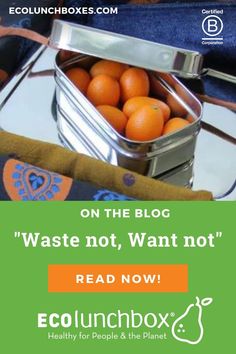 oranges in a metal container on a table with the words eco lunchbox over it