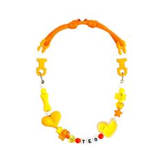 a necklace with yellow plastic beads and letters that spell out the word steetos