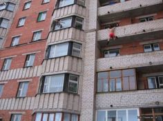 a tall brick building with lots of windows