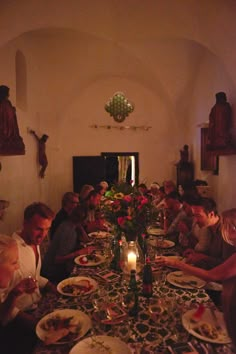 a group of people sitting around a dinner table