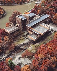 an aerial view of a house surrounded by trees