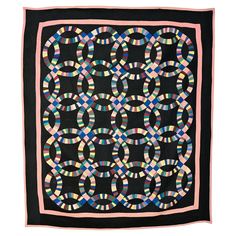 Double wedding ring was one of the most popular patterns of the 1920's and 30's. Almost always, it was done with pastel colors on a white ground. The Midwest Amish adapted this pattern to their own color sense, often choosing a black ground. The black background incorporated in this quilt is a cotton sateen. This fine example, most likely from Ohio, was done entirely of solid color cottons. The quilting in the border is done with a cable pattern and a variety of geometric patterns were used within the quilt. The quilt is in excellent, probably unwashed condition. Measurements ate 74" x 86". Both the pattern and choice of colors make for a very vibrant pattern. Octagon Quilt, Ocean Waves Quilt, Double Wedding Ring, Double Wedding Ring Quilt, Popular Patterns, Black Color Combination, Double Wedding Rings, Black Ground, Wedding Ring Quilt