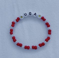 Show your school pride and complete your game day outfit with a custom red and white beaded bracelet for the University of Georgia! Customized Red Casual Jewelry, Personalized Red Stretch Bracelet, Casual Style, Customized Casual Red Jewelry, Casual Customized Red Jewelry, Casual Customized White Wristband, Casual Red Customized Jewelry, Red Personalized Casual Wristband, Personalized Red Casual Wristband, Customizable White Wristband For Game Day