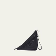 Prada "Grace" calf leather triangle pouch with embossed logo  Detachable wristlet strap Can be worn as a pouch clutch bag or wristlet  Zip top closure  Approx. 5.5"H x 10"W x 4.7"D Made in Italy Triangle Pouch, Prada Triangle, Leather Pouch, Embossed Logo, Zip Top, Calf Leather, Clutch Bag, Prada, Tops Designs