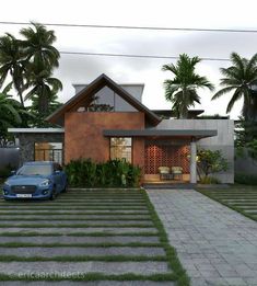 a blue car parked in front of a house with palm trees and bushes around it