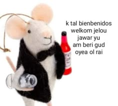 a stuffed mouse holding a bottle and a glass in it's hand with the caption