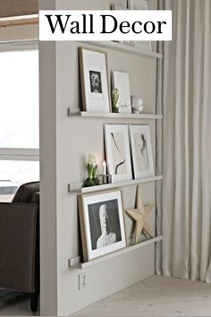 a living room filled with furniture and pictures