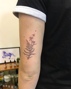 a person with a tattoo on their arm