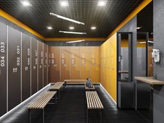 an empty locker room with benches and lockers