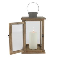 a wooden lantern with a lit candle inside