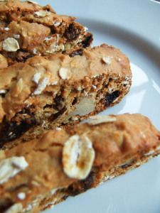 some food is on a white plate and it looks like granola bars are cut in half