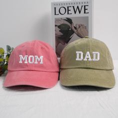 , Classic Dad Cap, Mom and Dad, Orange Cap, Pigment dyed, Pregnancy, Pumpkin Spice, Set of 2 Hats, Vintage Style Caps PRODUCT AND BRAND DETAILS ➤ Gildan ® brand ➤ Unisex & Classic fit ➤ 8 oz./yd² (US) 13.3 oz./L yd (CA), 50/50 cotton/polyester, 20 singles - Heather Sport colors are 60/40 polyester/cotton PERSONALIZED GUIDE: Custom sweatshirts, hoodies, and tees will usually have four embroidery positions: ➤On the chest: Left chest (above the heart), right chest, middle chest. ➤On the sleeve: Left sleeve or right sleeve (you can customize both, one side is free). ➤On the back of the shirt: In the middle. ➤In the hood for hoodies. If you want to embroider any of these positions, please place an order and let us know in the Personalized box or via an Etsy message. NOTES WHEN PURCHASING ✅ Chec Gifts For New Dads, Dad Caps, Custom Sweatshirts, New Dads, Personalized Products, Pregnancy Announcement, Mom And Dad, Style Vintage, Vintage Stil