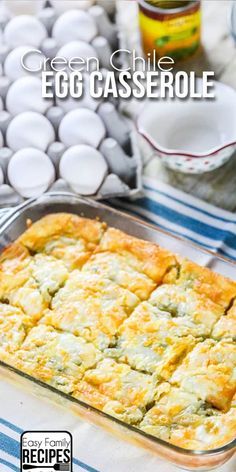 green chile egg casserole in a glass baking dish on a blue and white tablecloth