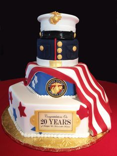 a cake made to look like a marine's hat and flag is on display