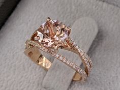 an engagement ring with a fancy pink diamond