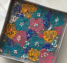 a tray that has some colorful flowers on it