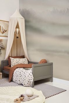 a child's bedroom decorated in neutral colors