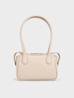 In soothing oat, this Bosie top handle bag makes a quiet statement with its distinctive shape. Featuring two elongated handles, this cute and chic piece is an updated version of the classic lady-like bag style. Equipped with a zip closure that will keep your belongings secure, it exudes a modern femininity that can be dressed up or down to suit the occasion -- it will work well for both work days and the weekends. Charles Keith, Bag Style, Handle Bag, Oats, Bag Making, Top Handle, Fashion Bags, Top Handle Bag, Handles