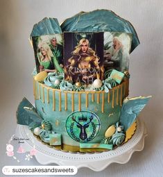 a birthday cake decorated with photos and decorations