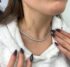 This 22CT T.W 3 Prong Lab Grown Diamond Tennis Necklace is a timeless and elegant piece featuring a 22CT total weight of Lab Grown Diamond, a 3 prong setting in 14K White Gold, and a personalized radiance, ensuring a secure fit. This Tennis Necklace is Made in Los Angeles's Historic Jewelry District, and all Diamonds are Graded by a GIA Certified Gemologist. Stone Type: Lab Grown Diamonds Carat: 22CT T.W. Shape: Round - 3 Prong Color: F Clarity: VVS1 Cut: Excellent Chain Length: 16 inches Please Note: We are able to customize any chain to your desired length, please contact us to adjust the chain. Historic Jewelry, Diamond Tennis Necklace, Tennis Necklace, Wedding Jewellery Necklace, Wedding Necklace, Chain Lengths, Chain Length, Prong Setting, Lab Grown