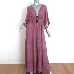 Gently worn. Great condition. No flaws. *Size tag is missing - est Size Small; see measurements to ensure fit* -**- V-neck Maxi Dress With Tassel Ties For Vacation, V-neck Vacation Dress With Tassel Ties, V-neck Boho Dress With Tassels For Festival, Summer Boho V-neck Dress With Tassel Ties, Summer Boho Dress With V-neck And Tassel Ties, Casual V-neck Maxi Dress With Tassels, V-neck Tassel Tie Beach Cover-up Dress, V-neck Beach Cover-up Dress With Tassel Ties, Festival V-neck Maxi Dress With Tassels