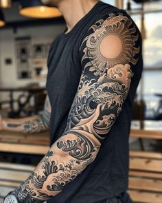 a man with a tattoo on his arm