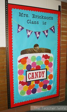 a classroom door decorated with a candy jar