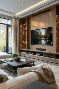 a living room filled with furniture and a flat screen tv mounted on a wall above a fireplace