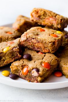 a pile of cookies with candy on top